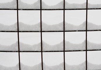 snow on a wire fence