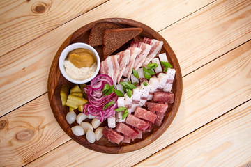 meat appetizer on the wooden background