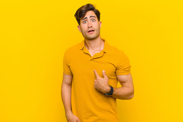  looking shocked and surprised with mouth wide open, pointing to self