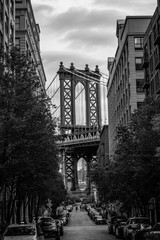 View of one of the towers of the Manhattan Bridge from the streets of the DUMBO district, Brooklyn,...