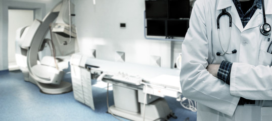 Abstract image of doctor in a white coat with a statostcope on the background of an angiograph in a modern hospital for heart surgery. Panorama.