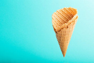 waffle cones from ice cream on blue color background