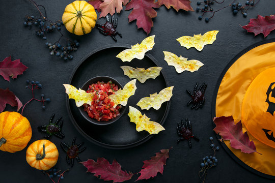 Halloween Table Setting With Red Salsa And Bat Tortillas