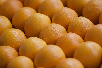 ripe tasty oranges in a shop window