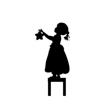recommend clip art: Silhouettes child stands on stools holds christmas star. Vector illustration