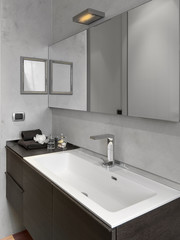 interior view of a modern bathroom with close up on the washbasin