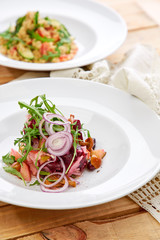vegetarian salad with beetroot, honey agaric and red onion