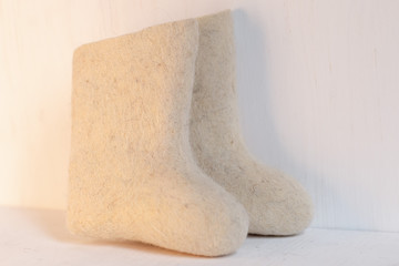 boots on a light background, shot indoors in the light from the window