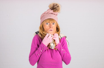 portrait of woman with hat, scarf and gloves, warm for winter