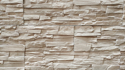Brick wall background. Texture home wall decoration made of natural stone. Copy space add text. Stone texture background. Stone for interior exterior decoration, industrial construction concept design