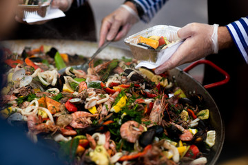 cooking vegetables. Stewing vegetables in a huge plate paella