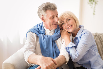 Happy mature couple enjoying time at home