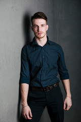 Obraz premium Portrait of a bearded man in a dark-colored shirt.