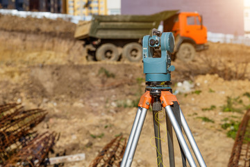 Surveyor equipment GPS system or theodolite outdoors at highway construction site.Measuring instrument close-up. Surveyor engineering with total station