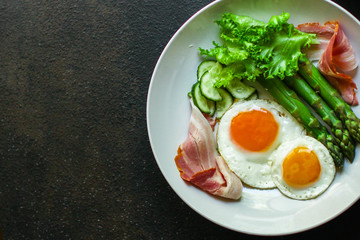 healthy breakfast (fried eggs, bacon, vegetables, asparagus beans, coffee and more) menu concept. food background. copy space. Top view