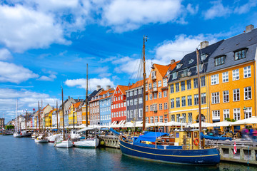 Scenic summer view of Nyhavn pier with colorful buildings and boats in Old Town of Copenhagen, Denmark - obrazy, fototapety, plakaty