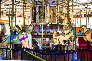Children's Carousel in a public park - 296157291