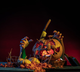 Obraz premium Scary Halloween pumpkins on wood in a spooky place at night. Poster concept.