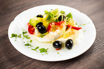 Homemade pickled gentian, moldy cheese in oil with vegetable