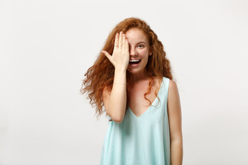 Fototapeta premium Young smiling redhead woman in casual light clothes posing isolated on white wall background studio portrait. People sincere emotions lifestyle concept. Mock up copy space. Covering face with hand.