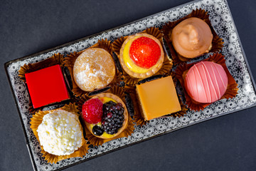 mignon pastry on rectangular ceramic plate