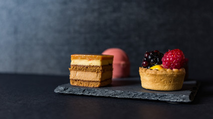 sweet mignon on slate plate on a black background