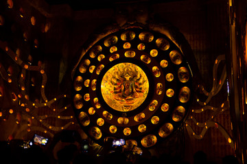 Durga Puja ,Diwali festival or Christmas decoration with warm lights and small idols.