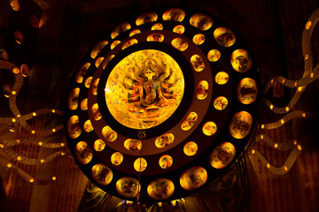 Durga Puja ,Diwali festival or Christmas decoration with warm lights and small idols.