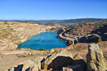 Fototapeta na wymiar heart shaped blue quarry lake. Kadykovsky quarry, Balaklava, Crimea. Travel, attractions.One of the lowest points of Crimea is in Sevastopol, at the altitude of 14 meters below sea level.