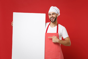 Cheerful chef cook or baker man in striped apron white t-shirt toque chefs hat isolated on red...