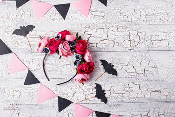 Halloween wreath with pink flowers