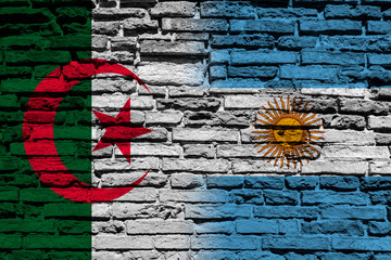 Flag of Algeria and Argentina on brick wall