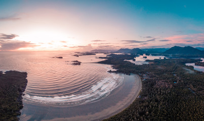 Aerial view over Tofino Pacific Rim national park with drone from above Cox Bay Vancouver Island...