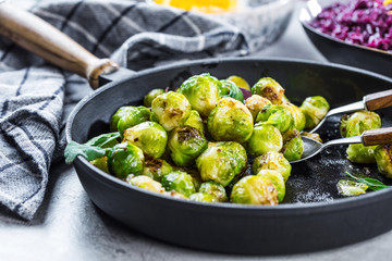 Frying pan with roasted brussel sprouts on table