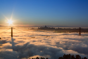 Aerial view of Golden Gate Bridge with Low Fog at Sunrise