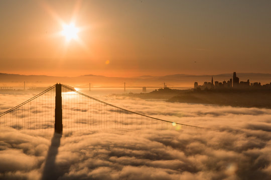 Aerial view of Golden Gate Bridge with Low Fog at Sunrise