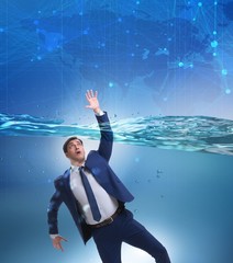 Drowning businessman in insolvency and bankruptcy concept