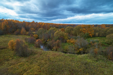 Aerial view with a drone. Landscape with autumn forest and river