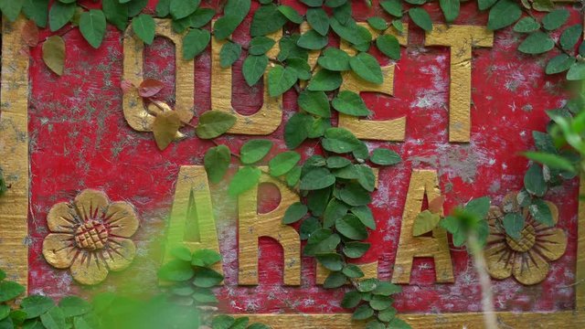 Closeup shot of the Quet area sign in a tropical spa