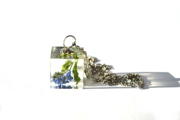 Beautiful epoxy resin jewelry with real dried flowers - forget me not. Cube-shaped handmade pendant...