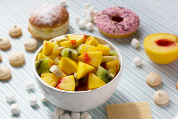 Fruit salad and sweets. Delicious and healthy breakfast.