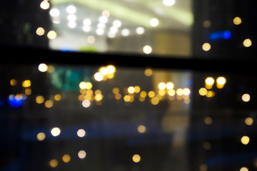 Abstract blurred view of lights in the night window