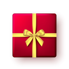 Red gift box with golden ribbon and bow, top view.