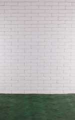 empty interior with green floor and decorative white brick wall