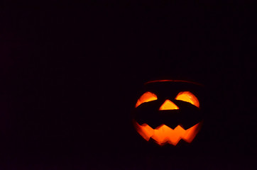 halloween pumpkin jack-o-lantern on black background
