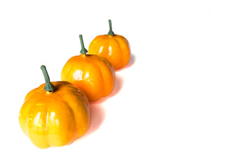 Halloween and harvest concept. Isolated autumn background of fruits and vegetables: pumpkins on a white background with copy space