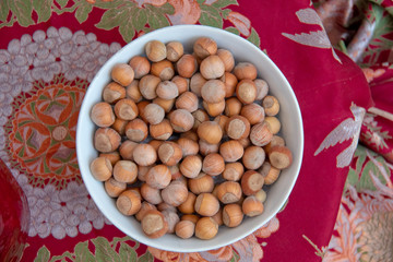 Food background. Hazelnuts texture. Top view . Hazelnut Nut Health Organic Brown Filbert Autumn Background Concept . Hazelnuts. Stack of hazelnuts.