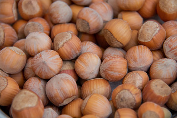 Food background. Hazelnuts texture. Top view . Hazelnut Nut Health Organic Brown Filbert Autumn Background Concept . Hazelnuts. Stack of hazelnuts.
