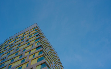 modern building with blue sky and clouds