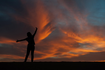 silhouette of woman in the desert